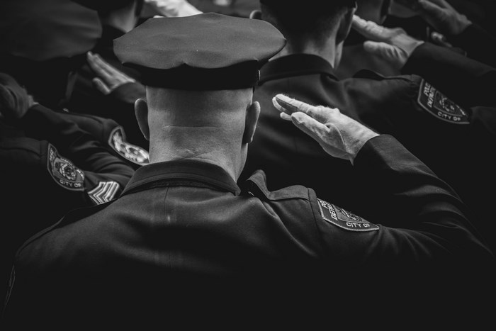 NYPD officers saluting