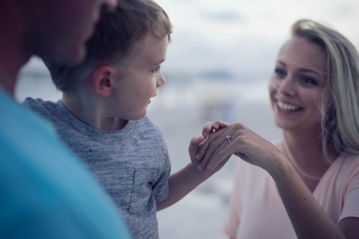 Family looking at engagement ring