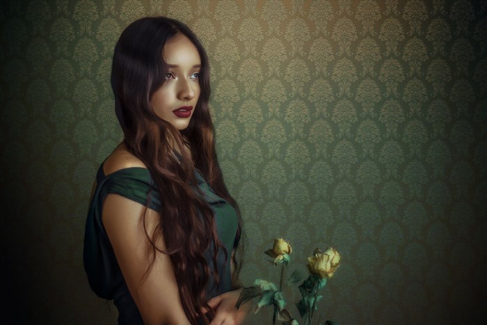 Woman with long hair and dead roses