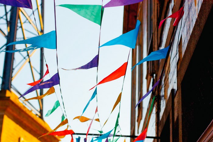 Colorful bunting flags strung across a street