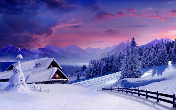 Snowy mountain landscape with cottages and forest at sunset