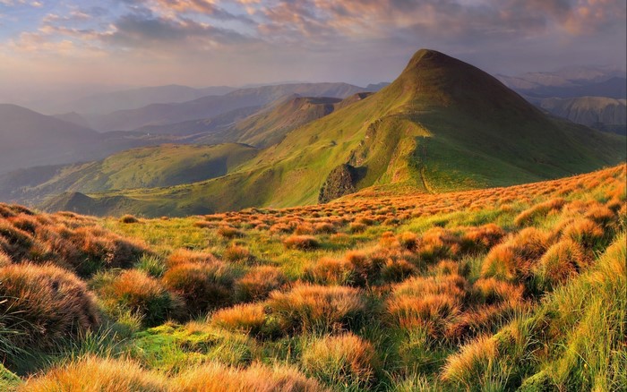 Mountain landscape with golden grass and rolling hills