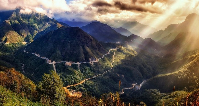 Mountain road in Vietnam with sun rays