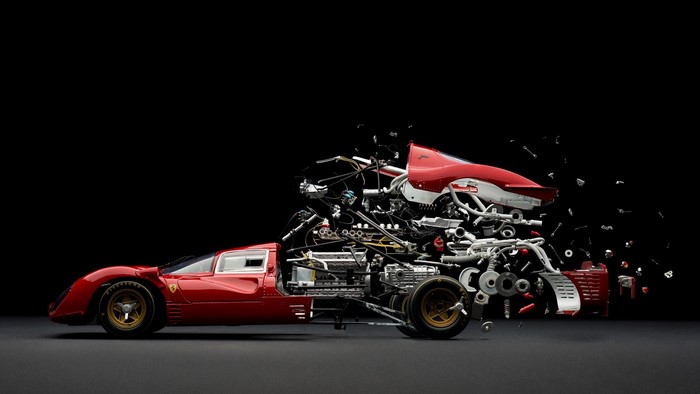Ferrari car disassembled with engine and parts exploding