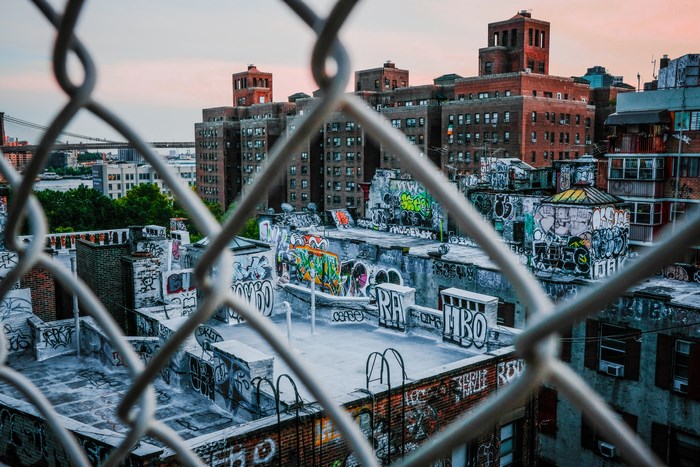 Graffiti-covered rooftops in Manhattan at sunset