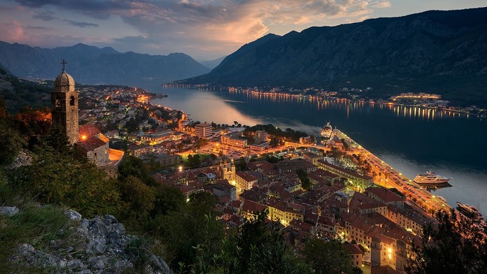 Kotor town at dusk with bay and mountains