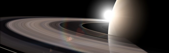 Saturn's rings with the sun and planet