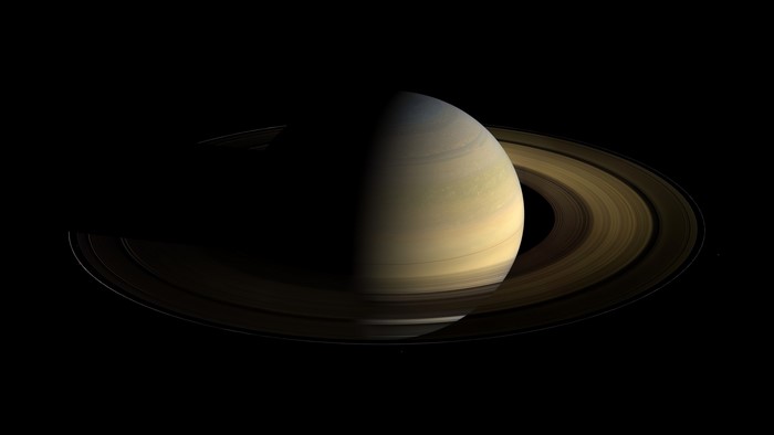 Saturn and its rings against a black background