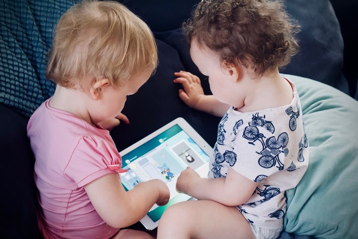 Two Toddlers Playing Toca Boca on Tablet
