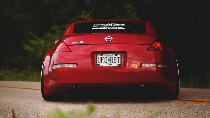 Red Nissan 350Z with custom license plate