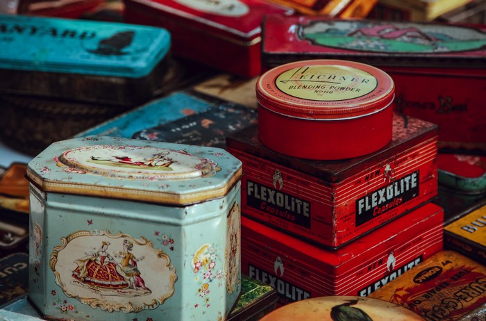 Collection of vintage tins including Flexolite and Leichner