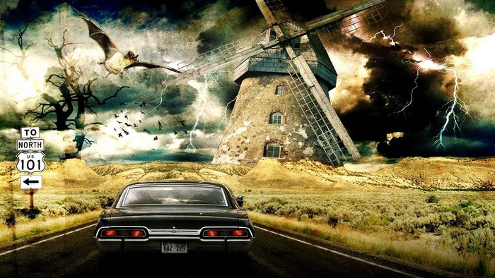 Supernatural car driving towards a windmill during a storm