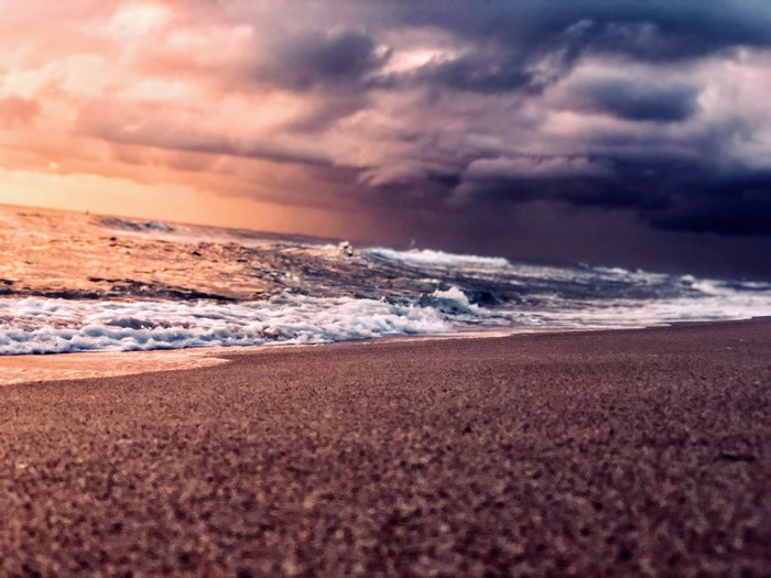 Shoreline at Dusk with Dramatic Clouds