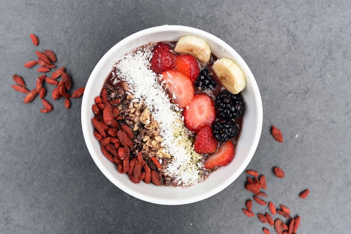 Acai bowl with strawberries, bananas, blackberries, and goji berries