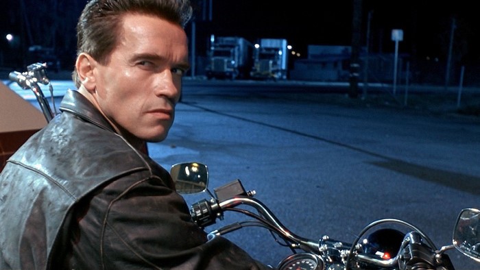 Arnold Schwarzenegger as the Terminator on a motorcycle