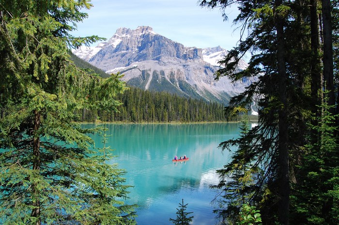 Canoe on Emerald Lake with Mountains in Banff