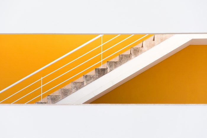 Minimalist Staircase with Yellow Wall in Lisbon