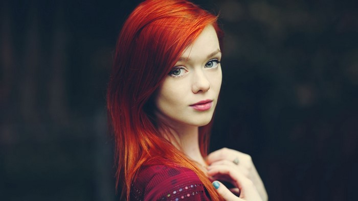 Woman with red hair and green eyes