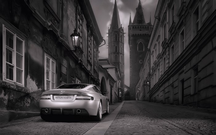 Aston Martin DBS on a cobblestone street in Prague