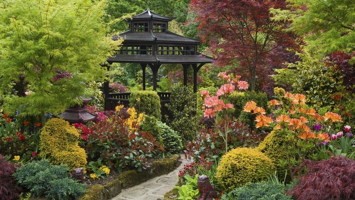 Japanese garden with gazebo and colorful flowers