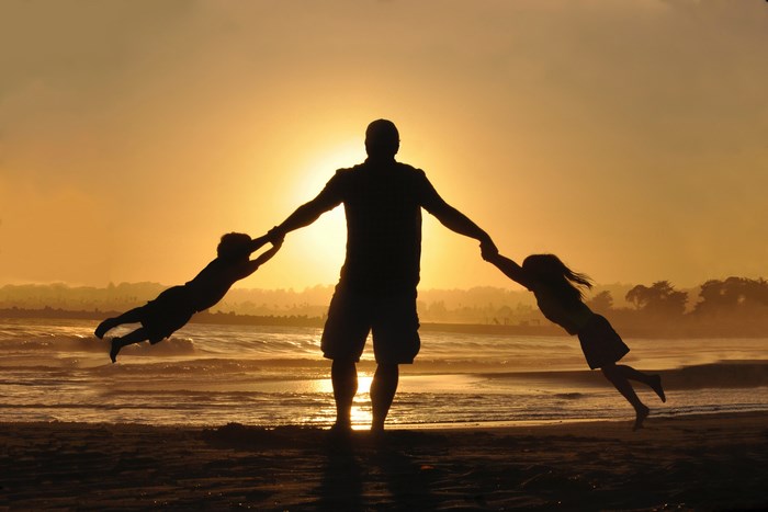 Father Swinging Kids Silhouette at Beach Sunset