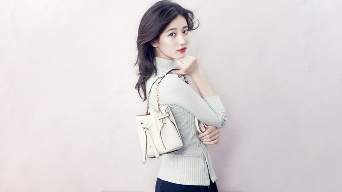 Bae Suzy from Miss A with a white handbag