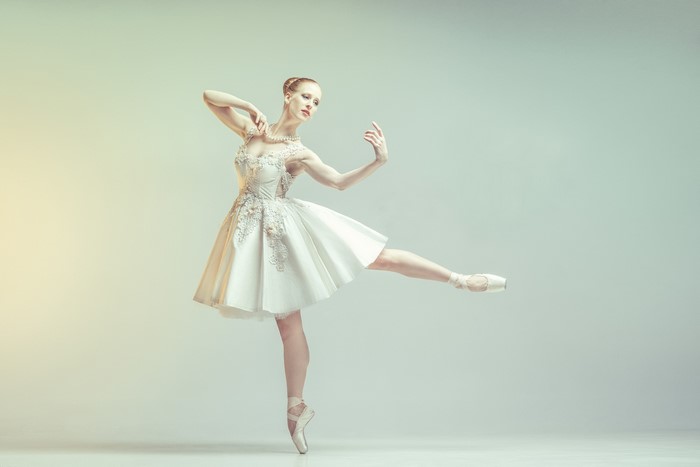 Ballerina in white tutu performing ballet