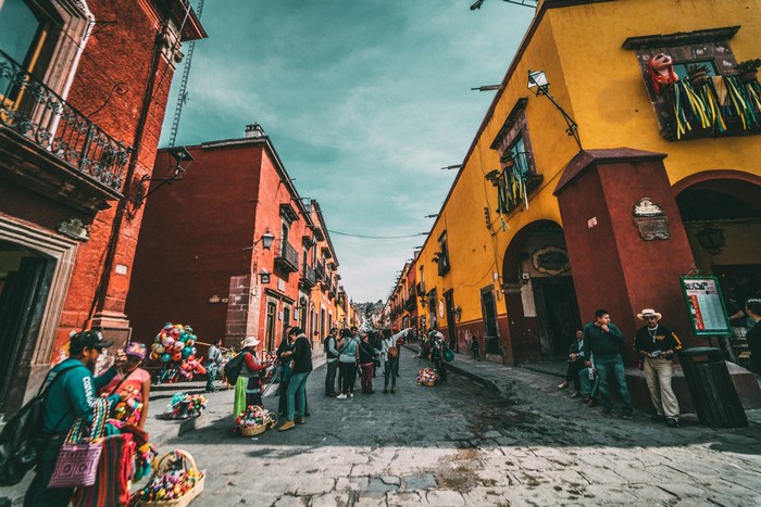 Street scene in San Miguel de Allende, Mexico with people and buildings