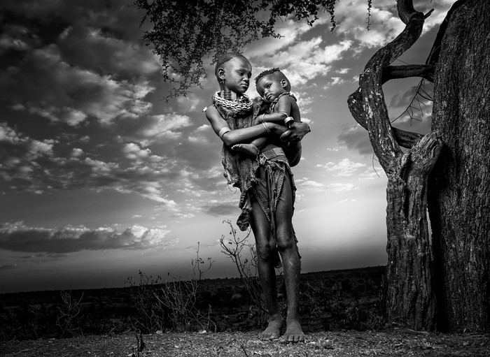 Two children in traditional clothing in Africa