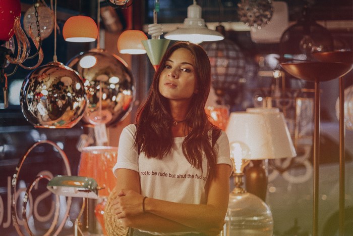 Woman in a shop with lamps