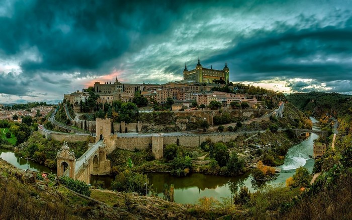 Toledo city with river and bridge at sunset