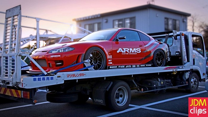 Red Nissan Silvia S15 on a tow truck