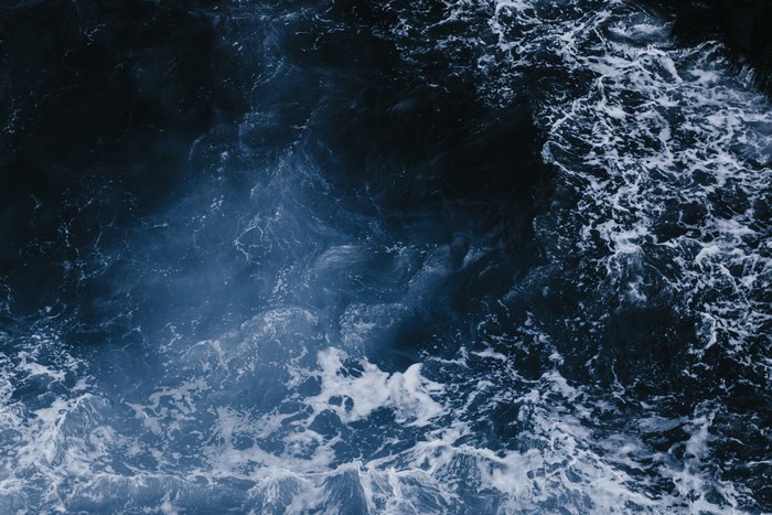 Dark Blue Ocean Waves with White Foam