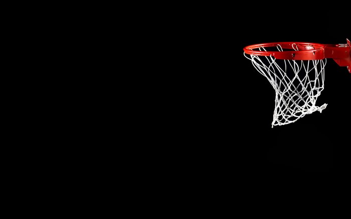 Basketball hoop and net against black background