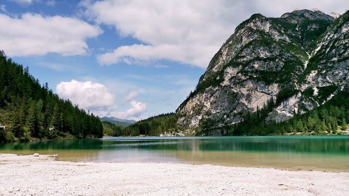 Serene Alpine Lake with Mountain and Forest in Italy