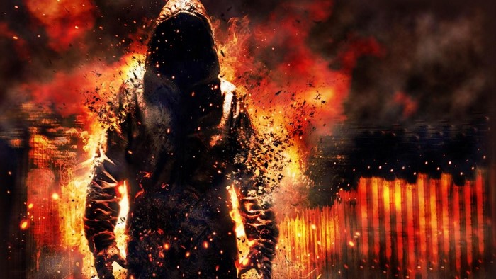 Figure engulfed in flames in a burning city
