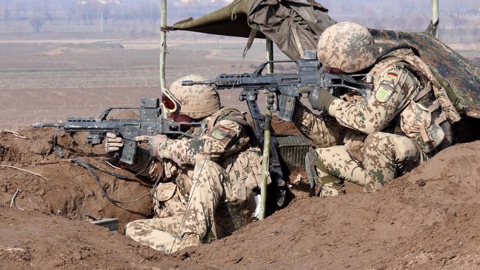 German soldiers with Heckler & Koch G36 rifles in a trench