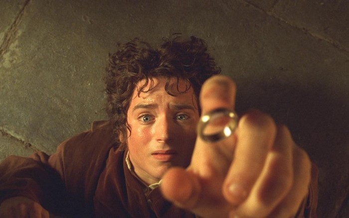 Frodo Baggins from The Lord of the Rings holding the One Ring
