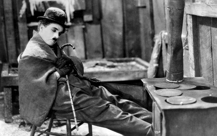 Charlie Chaplin as The Tramp in a cold setting