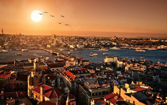 Istanbul cityscape with Golden Horn and Galata Bridge at sunset