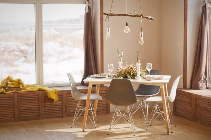 Modern dining room with chairs and table near window
