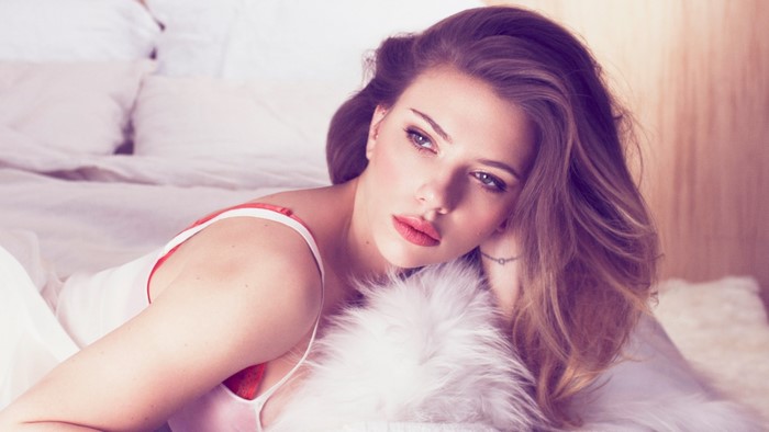 Scarlett Johansson in bed wearing red bra and white top