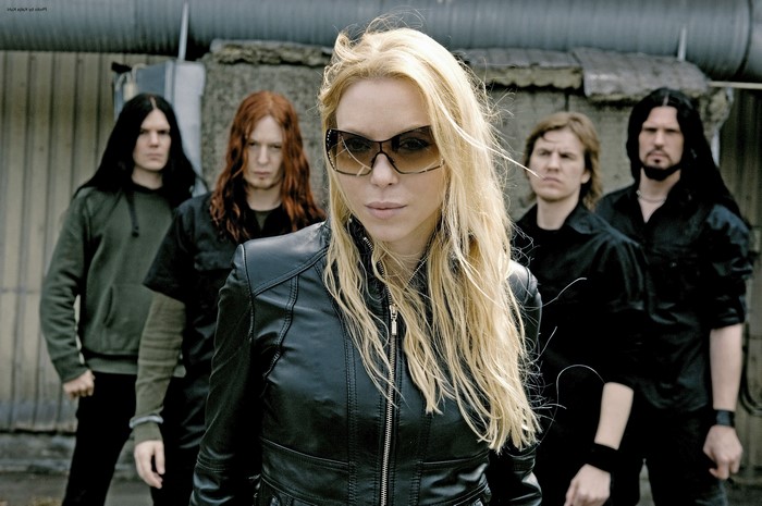 Arch Enemy band members posing outdoors