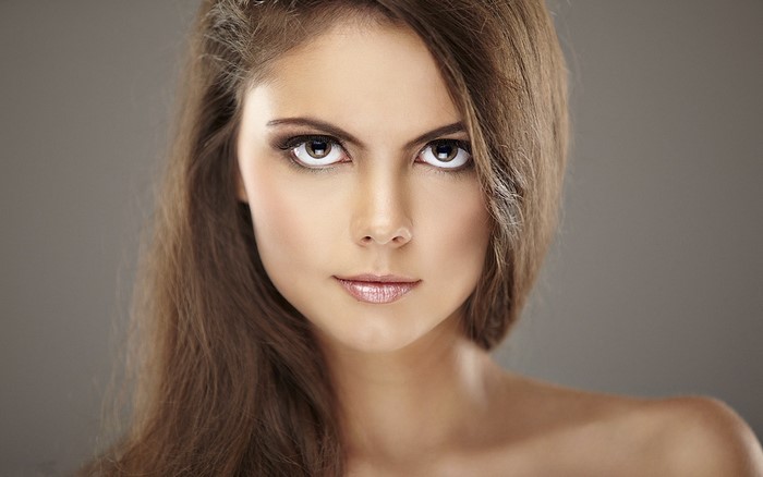 Portrait of a Woman with Long Brown Hair and Intense Eyes