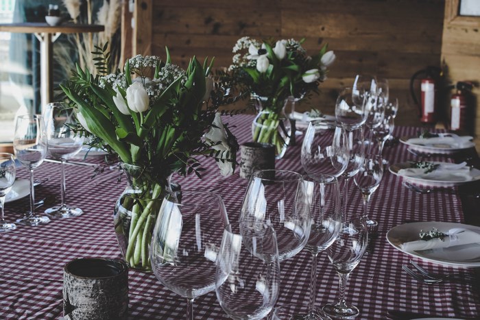 Table setting with flowers and wine glasses