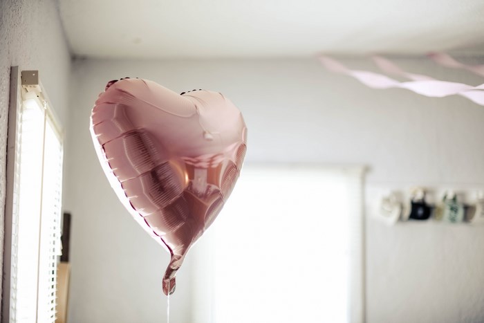 Pink Heart-Shaped Balloon Floating Indoors