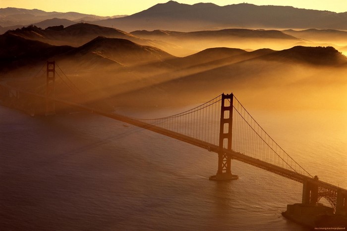 Golden Gate Bridge in mist at sunset
