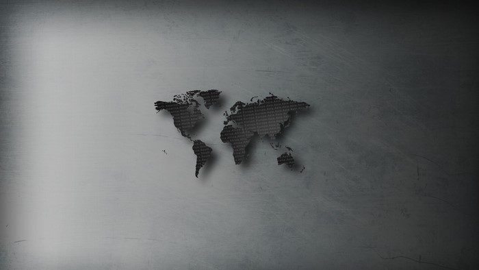World map with text on a scratched metallic background