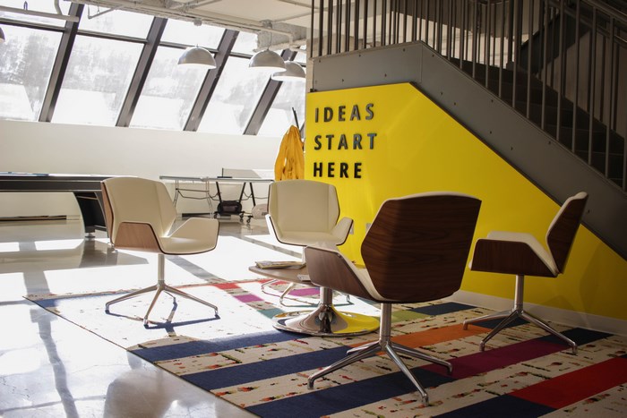 Modern office with chairs and stairs