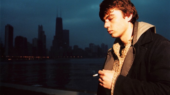 Sergei Bodrov Jr. smoking in front of Chicago skyline
